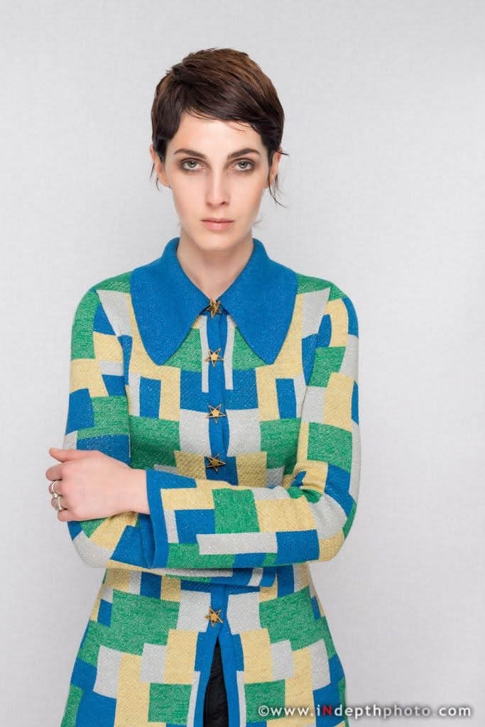 Model in colourful geometric jacket
