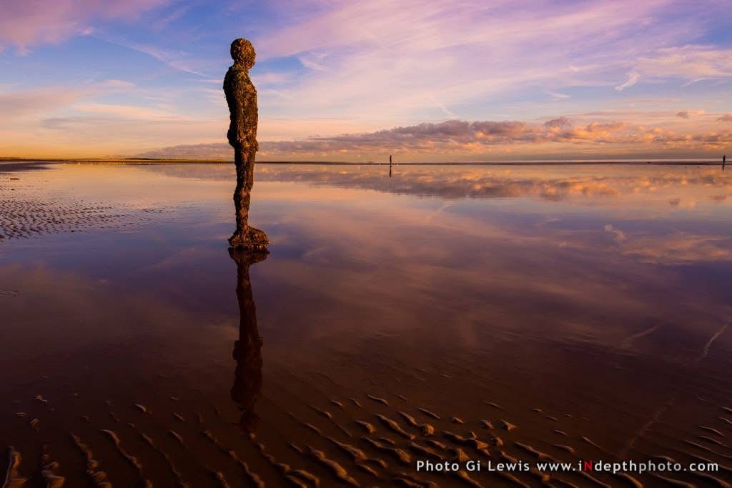 Crosby beach sculpture reflected at dusk