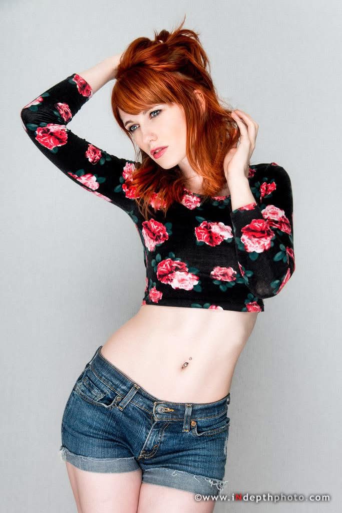 Model portrait with red hair and floral top